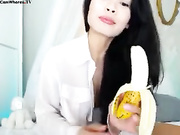 Brunette is sitting on a dildo