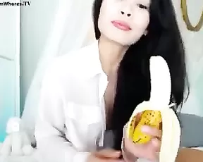 Brunette is sitting on a dildo