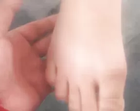 Asian cutie shows her feet at the gasstation