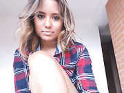 Busty woman strips naked and has fun