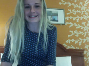 Blonde massages her wet pussy