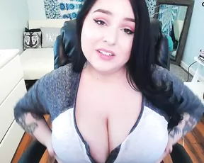 Busty Kelly teases with her large natural jugs
