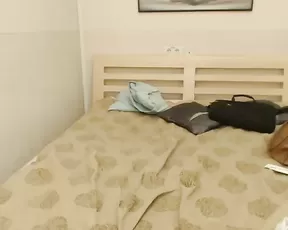 A red haired hottie suckles on a fake cock