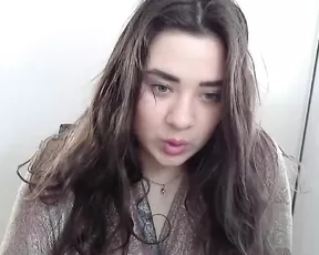 Black chick licks her tits