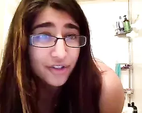 Exotic teen posing in front of a webcam