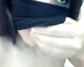 A brunette is giving a blow job