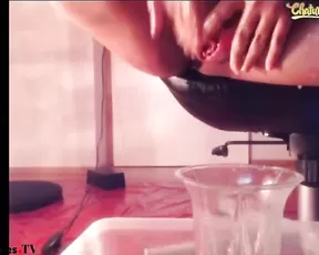 Filthy slut squirting piss into a jar