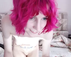 A cute looking red haired teen gets naked on cam
