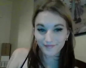 Mature raven haired slut with a smile on her face masturbating