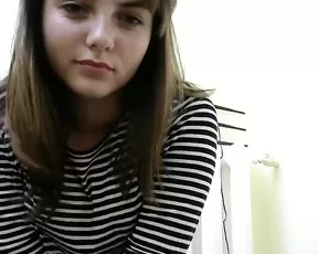 A naked tattooed brunette is sucking cock