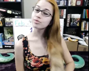 Alex Coal brushes her hair