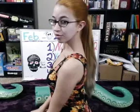 Alex Coal brushes her hair