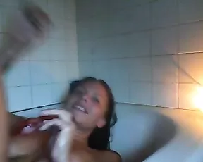 Short haired woman uses a dildo