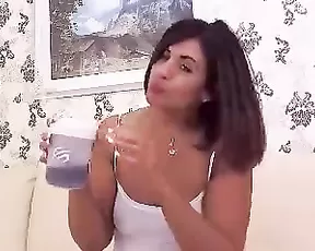 A teen with blonde hair is getting her vibrator sticky with pussy juice