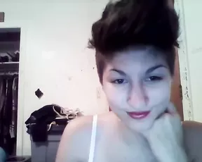 A redhead is teasing her sex toy