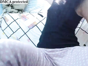 A sexy little babe drills up her ass and cunt on cam