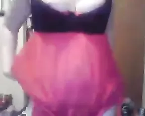 A dark haired slut is on her knees eating cock