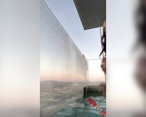 Flowerbomb naked in the pool at sunset lives porn