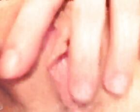 A small brunette licks a dildo
