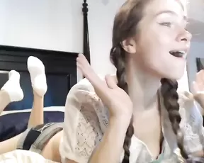 Skinny babe is sitting down on something