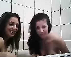 Hot brunette smoking and servicing a cock