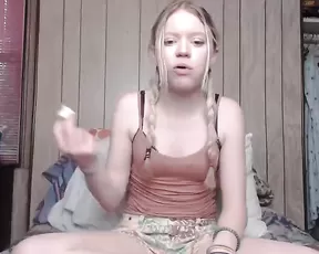 Fair haired German chick handling a cock