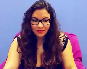 Blue haired pretty lady talks for the camera