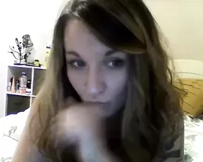 Brunette with braids gobbling up a cock