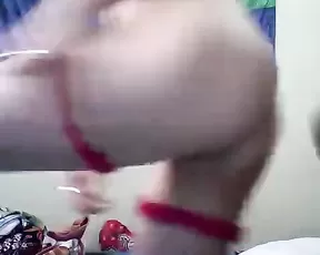 A dark haired babe is dressing up before she is masturbating