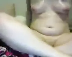 A sweet curvy woman uses toys