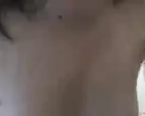 A dark haired babe with small tits on cam