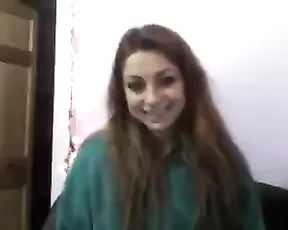 Busty woman strips naked and has fun
