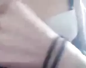 A small breasted red head is getting off on camera