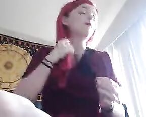 A small breasted red head is getting off on camera