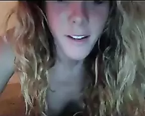 Redhead with big tits gives a blowjob