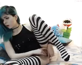 A curly chick is jacking off