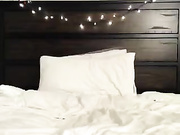 A large dildo enters a small pussy