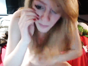 Young blonde with small tits naked in bed fingering webcam show