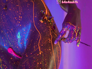 HEYBANANA erotically dances naked and is doused with glowing paint