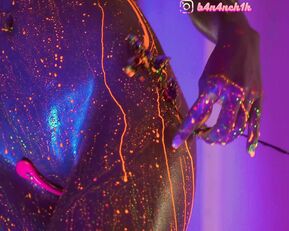 HEYBANANA erotically dances naked and is doused with glowing paint