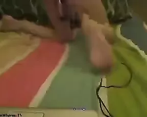 A brunette is playing with herself