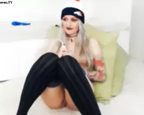 Busty woman licks her dildo