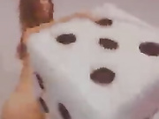 Babe in glasses plays with a dildo