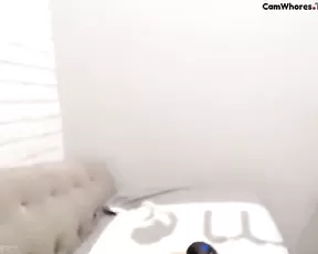 Cute brunette on her side while handling a cock