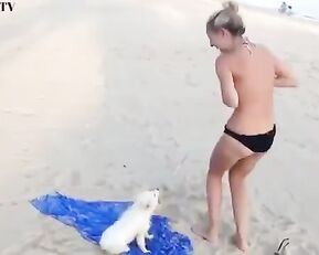 Slim and sexy girl on the beach play with dog webcam show