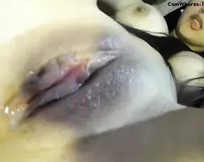Cutie plays with a large cock