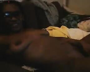 Black naked girl in glasses teasing in bed webcam show
