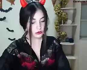 A petite brunette looking into the cam and sucking hard
