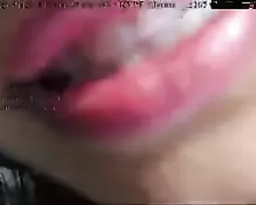 A blonde is using a dildo on her cunt