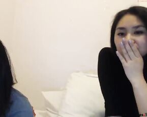 Tasty asian lesbians teasing in bed webcam show